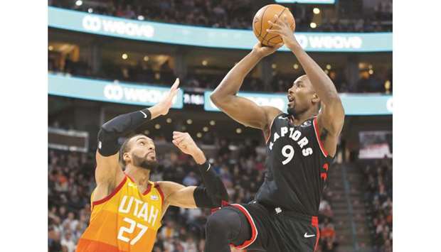 Toronto Raptors center Serge Ibaka (right) shoots the ball against Utah Jazz center Rudy Gobert during the first quarter at Vivint Smart Home Arena on Monday. PICTURE: USA TODAY Sports