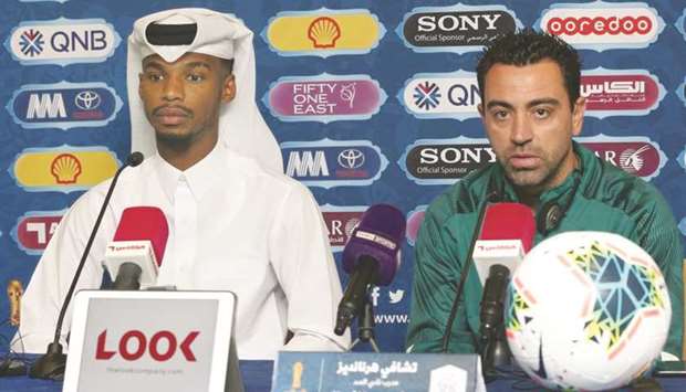 Al Sadd coach Xavi (R) and player Hussam Kamal at their pre-match press conference yesterday.