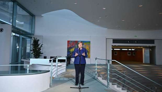 German Chancellor Angela Merkel makes a press statement before meeting with the heads of associations of the German economy and the trade unions on the economic consequences of the spread of the coronavirus COVID-19 at the Chancellery in Berlin