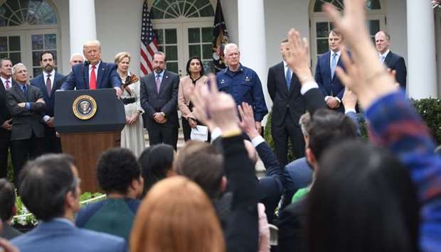 US President Donald Trump takes questions from reporters at a news conference about COVID-19, known as the coronavirus, in the Rose Garden of the White House in Washington, DC.