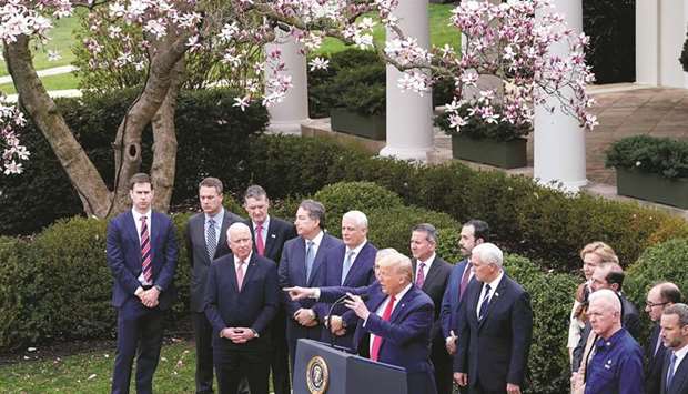 With members of the White House Coronavirus Task Force, Trump speaks at a press conference in the Rose Garden of the White House.