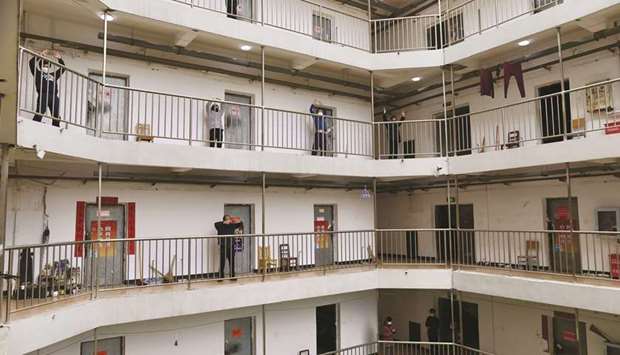 Patients who have been cured of the novel coronavirus disease and discharged from hospitals exercise at a quarantine centre in Wuhan, the epicentre of the novel coronavirus outbreak, in Hubei province, China.