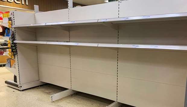 Empty shelves of eggs are seen at a supermarket, as the number of coronavirus cases grow around the world, in London