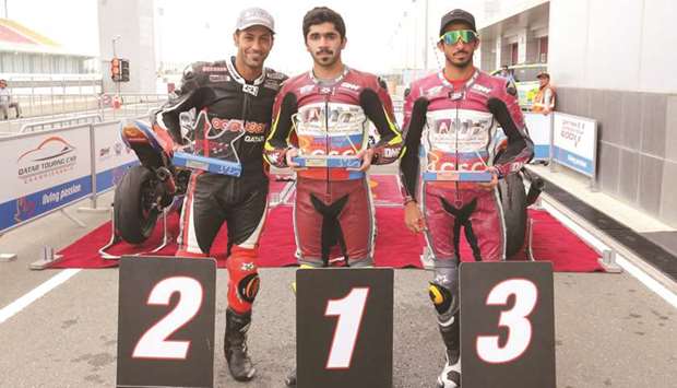 Qatar Superstock 600 champion Abdulla al-Qubaisi (centre) poses with runner-up Saeed al-Sulaiti (left) and Mashel al-Naimi, who finished third, after the final round at the Losail International Circuit yesterday.