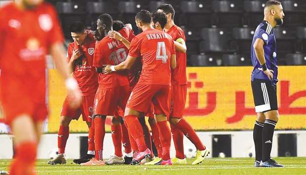Al Duhail players (in red) celebrate their goal during their Amir Cup quarter-final against Al Sailiya at Jassim Bin Hamad Stadium yesterday. PICTURE: Noushad Thekkayil