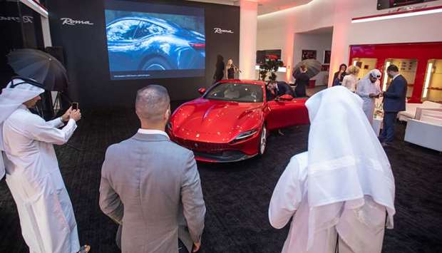 Invitees view the Ferrari Roma at the exclusive event held at the Alfardan Sports Motors showroom.