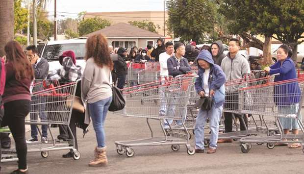 Hundreds of shoppers lined-up for blocks yesterday, waiting to purchase supplies at a Costco due to the global coronavirus outbreak, in Garden Grove, California.