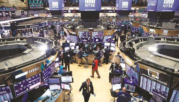 Traders work on the floor of the New York Stock Exchange on Friday. Interest rate cuts wonu2019t cure the coronavirus but investors are still hoping the Federal Reserve can take some actions to help soothe the roiled stock market.
