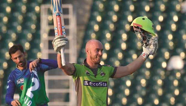 Lahore Qalandars Chris Lynn celebrates after scoring a century during the PSL match against Multan Sultans at the Gaddafi Cricket Stadium in Lahore yesterday. (AFP)