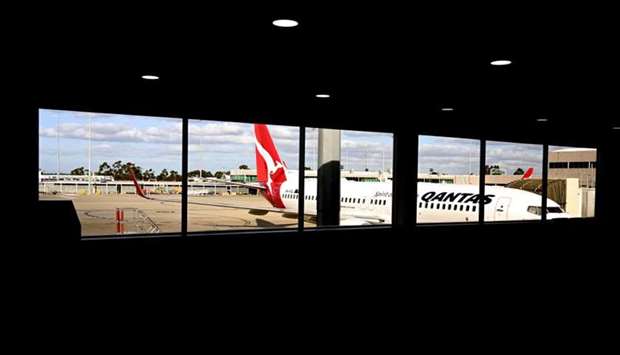 A plane sitting at a gate at Tullamarine Airport in Melbourne. AFP