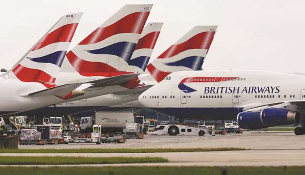 A passenger aircraft, operated by British Airways, taxis on the tarmac at London Heathrow Airport. British Airways owner IAG will slash capacity for April and May by at least 75% amid the collapse in demand and government restrictions aimed at slowing the coronavirus pandemic.