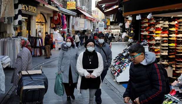 People wear protective face masks due to coronavirus concerns in Istanbul, Turkey