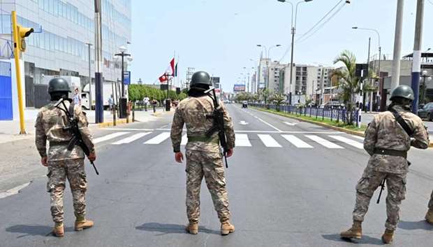 Peruvian army soldiers control traffic in Lima yesterday in an attempt to persuade the population to stay at home, one day after President Martin Vizcarra announced a State of Emergency and a two-week nationwide home-stay quarantine together with the closure of all borders to fight the spread of the novel COVID-19 coronavirus.
