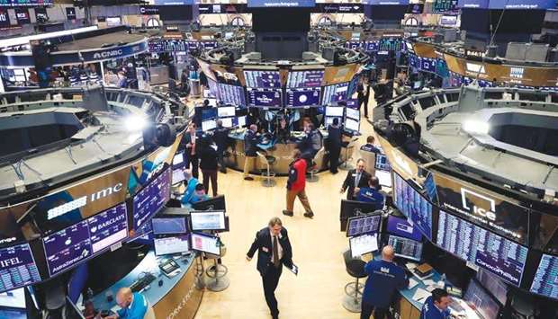 Traders work on the floor of the New York Stock Exchange. The Trump administration plans to keep US stock markets open despite volatility, though trading hours may be shortened, Treasury Secretary Steven Mnuchin said.