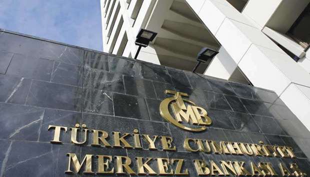 Turkeyu2019s central bank headquarters is seen in Ankara (file). Marking its seventh straight cut in an aggressive bid, the bank cut its benchmark one-week repo rate to 9.75% from 10.75%, pushing real rates deeper into negative territory.