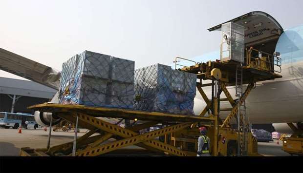 Cargo is unloaded from a Korean Air Lines freight plane arriving from China at the company's cargo terminal at Incheon International Airport in South Korea