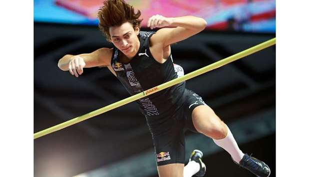 In this February 8, 2020, picture, Franceu2019s Armand Duplantis clears the bar to set the then world pole vault record of 6.17 metres at the Orlen Copernicus Cup 2020 in Torun, Poland. Duplantisu2019 manager Christian Olsson has revealed that the 20-year-old continues to train in the US for the Tokyo Olympics. (AFP)