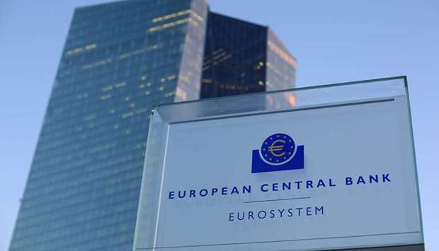 A euro currency symbol sits on a Eurosystem sign outside the European Central Bank (ECB) headquarters in Frankfurt. The ECB launched new bond purchases worth u20ac750bn ($817bn) at an emergency meeting late on Wednesday, in a bid to prevent a deep recession that threatened to outdo the 2008-09 global financial crisis.