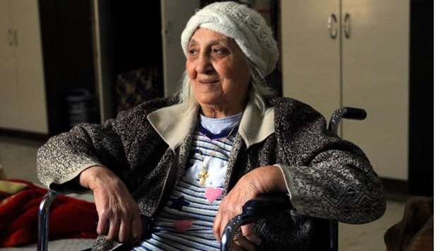 An elderly woman sits at a nursing house in Dohuk province, Iraq