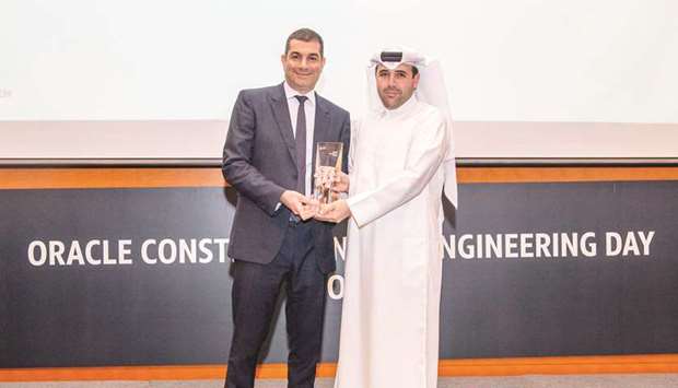 Ashghalu2019s engineer Khalid Maher al-Qatami receiving the award during Oracleu2019s annual awards ceremony in Doha.