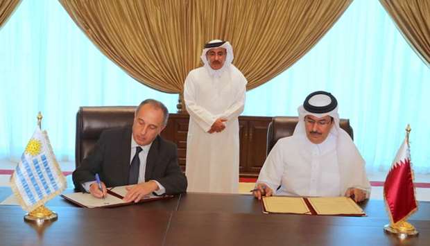 Qatar Civil Aviation Authority (CAA) Chairman HE Abdulla bin Nasser Turki Al Subaey and the Ambassador of the Republic of Uruguay to Qatar Sere Jorge Antonio sign the agreement