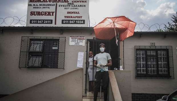 A man wears a mask amid concerns over the spread of the Covid-19 coronavirus outside a small clinic in Eldorado Park, Johannesburg, yesterday.