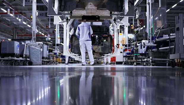 Cradles carry Volkswagen ID.3 electric automobile bodies at the automakeru2019s factory in Zwickau, Germany. Volkswagen said a two- to three-week factory closure put in place this week may not be sufficient, and told workers that drastic steps will be needed to protect liquidity as government lockdowns to fight the coronavirus make it impossible to do business as normal.
