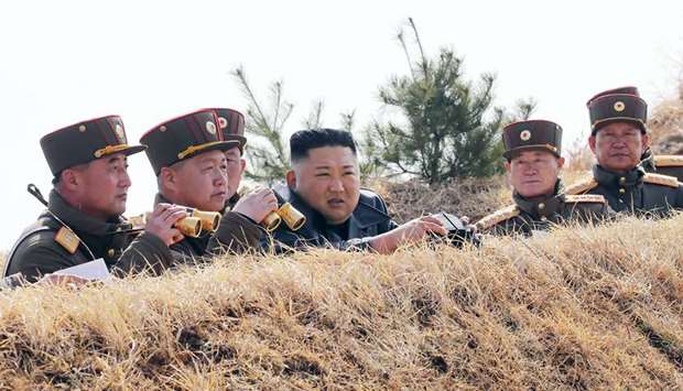 North Korean leader Kim Jong-un (centre) inspecting an artillery fire competition between large combined units of the Korean Peopleu2019s Army (KPA) on the western front.