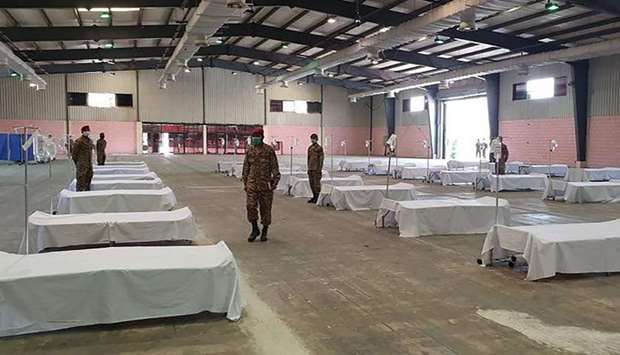 In this handout photograph taken and released by the Sindh health ministry on Friday, soldiers are seen at the mass isolation centre being set up in Karachiu2019s Expo Centre.