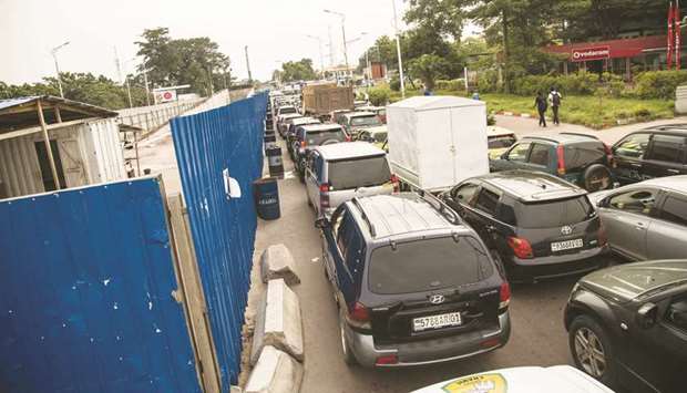 Cars are jammed along the under construction u201csaut-de-moutonu201d bridge on Mandela boulevard in Kinshasa, as part of DR Congou2019s presidentu2019s u201c100 daysu201d project.
