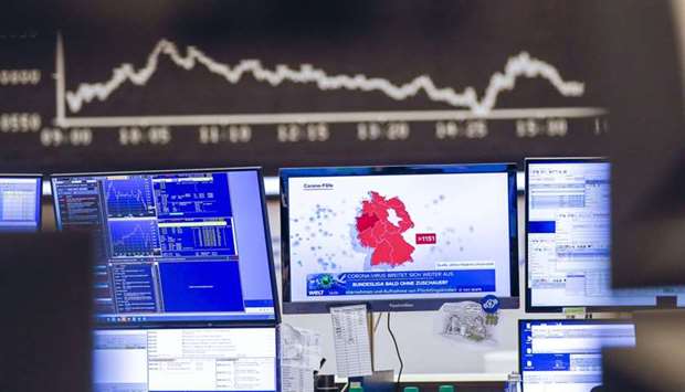 A television news report highlights a map of German coronavirus cases near the DAX Index curve inside the Frankfurt Stock Exchange. Europeu2019s stocks have suffered devastating declines in recent weeks as the spread of the coronavirus has seen everyday life in the region come to a near halt.