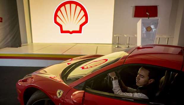 An attendee drives a vehicle into the Royal Dutch Shell gasoline station in Mexico City, Mexico. While the company is not abandoning its buyback entirely, completion of the programme is u201cnot likely to be feasible before the end of 2020u201d, Shell said yesterday.