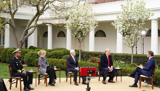 (From left) Surgeon General Jerome Adams, response coordinator for White House Coronavirus Task Force Deborah Birx, Vice President Mike Pence and President Donald Trump take part in a Fox News virtual town hall meeting yesterday with anchor Bill Hemmer, in the Rose Garden of the White House in Washington, DC.