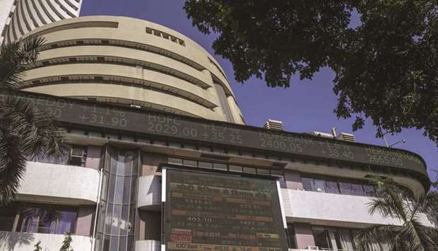 An electronic ticker board indicates latest figures for the Sensex at the Bombay Stock Exchange building in Mumbai. The Sensex closed up 2.7% to 26,674.03 points yesterday, after advancing as much as 5.7%.