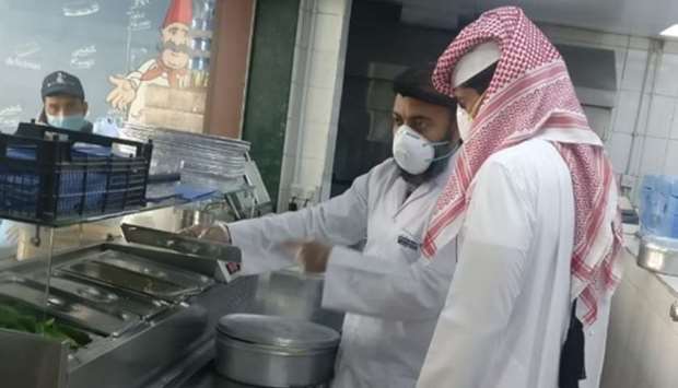 Inspection goes on at a food outlet.