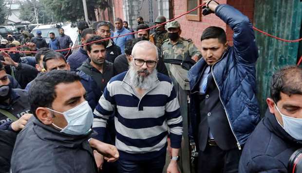 Omar Abdullah walks outside his residence following his release in Srinagar yesterday.