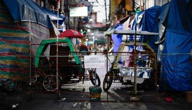 Makeshift barricades block some streets to contain the coronavirus disease (COVID-19) in Manila