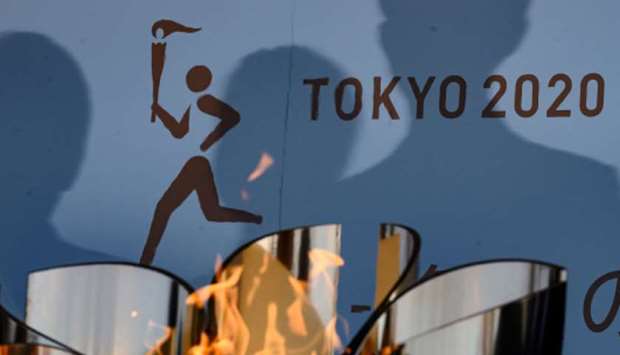 The logo for the Tokyo 2020 torch relay is pictured as the Olympic flame goes on display at the Aquamarine Fukushima aquarium in Iwaki in Fukushima prefecture, Japan, on Wednesday. (AFP)