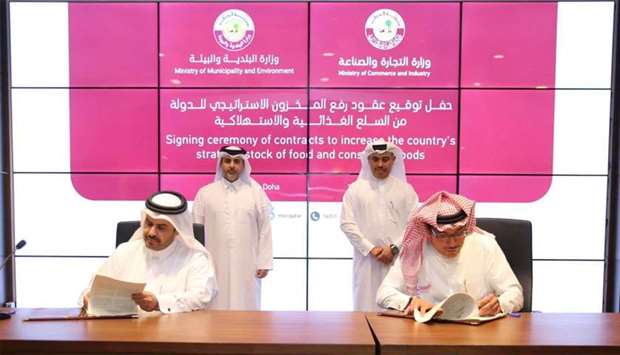 HE the Minister of Commerce and Industry Ali bin Ahmed al-Kuwari and HE the Minister of Municipality and Environment Abdullah bin Abdulaziz bin Turki al-Subaie witness the signing of agreements to increase the strategic food reserves on Thursday.