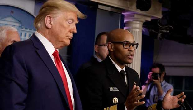 US President Donald Trump watches as Vice Admiral Jerome Adams, Surgeon General of the United States, speaks during a news conference, amid the coronavirus disease (COVID-19) outbreak, in Washington DC.