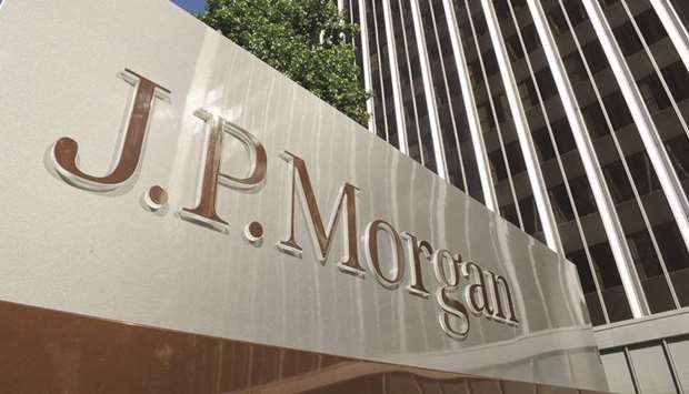 A JPMorgan sign is seen outside the office tower housing the financial services firmu2019s Los Angeles office. Revenue is swelling in a key part of JPMorganu2019s trading division as its teams stay engaged through violent price swings that have prompted some market players to pull back.