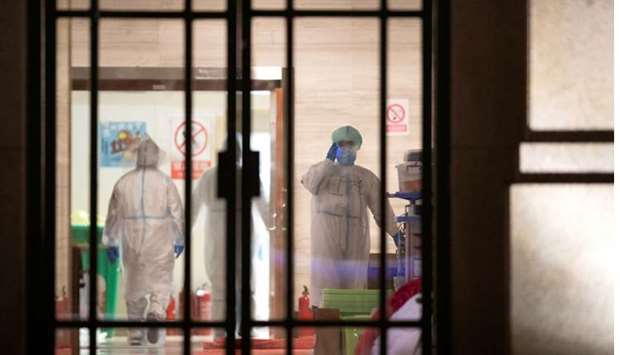 Medical staff in protective suits are seen inside a makeshift hospital that is closed following its last group of patients of the novel coronavirus have been discharged, in Wuhan, the epicentre of the novel coronavirus outbreak, in Hubei province, China