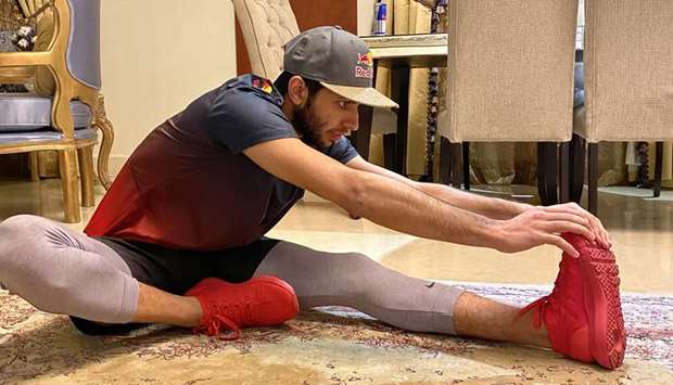 Qatari squash player Abdulla al-Tamimi trains at home as he self-isolates in times of Covid-19.