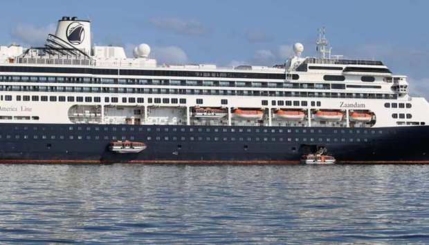 Passengers board a lifeboat from Holland America Line cruise ship MS Zaandam to be transported to her sister ship Rotterdam in Panama Bay, Panama.