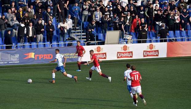 Minsk and Dinamo Minsk players vie for the ball during the Belarus league match in Minsk yesterday. (AFP)