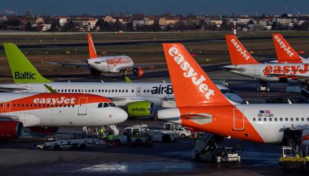 In this file photo taken on December 29, 2019, an aircraft operated by British low cost airline Easyjet prepares for take off as other planes are lined up at Tegel airport in Berlin.
