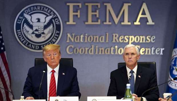 US President Donald Trump (left) and US Vice President Mike Pence listen during a roundtable meeting at the Federal Emergency Management Agency (Fema) headquarters in Washington, DC. The rescue package announced by the Trump administration includes about $500bn that can be used to back loans and assistance to companies, including $50bn for loans to US airlines, as well as state and local governments. It also has more than $350bn to aid small businesses. Then there is $150bn for hospitals and other health-care providers for equipment and supplies.