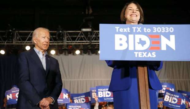 Sen. Amy Klobuchar (D-MN) joins Democratic presidential candidate former Vice President Joe Biden on stage during a campaign event yesterday in Dallas, Texas.
