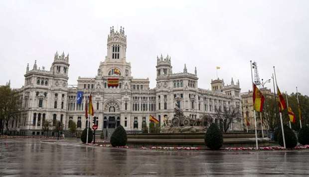The Spanish flag flutters at half mast at Madridu2019s City Hall, during the coronavirus disease (COVID-19) outbreak, in Madrid, Spain