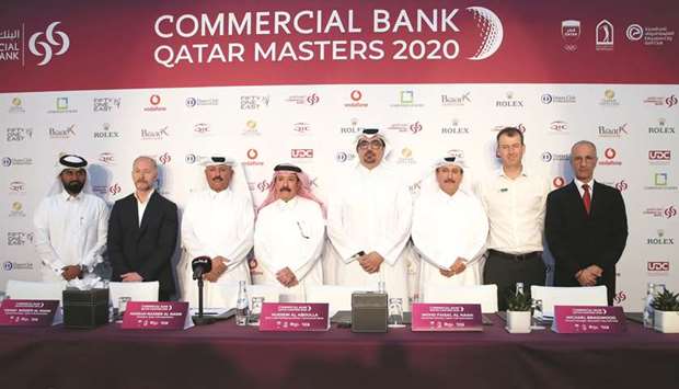 European Tour tournament director Mikael Ericsson (second from left), Commercial Banku2019s EGM, Chief Marketing Officer Hussein al-Abdulla (fifth from left) and officials of the Qatar Golf Association pose after the official Commercial Bank Qatar Masters press conference at the Education City Golf Club yesterday. At bottom, a view of the Education City Golf Club course with the Education City World Cup 2022 stadium in the background. PICTURE: Jayaram
